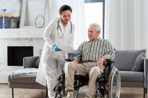 Nurse supporting a senior patient